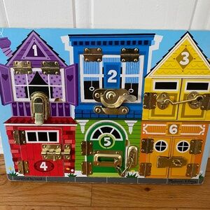 Latches board Melissa and Doug